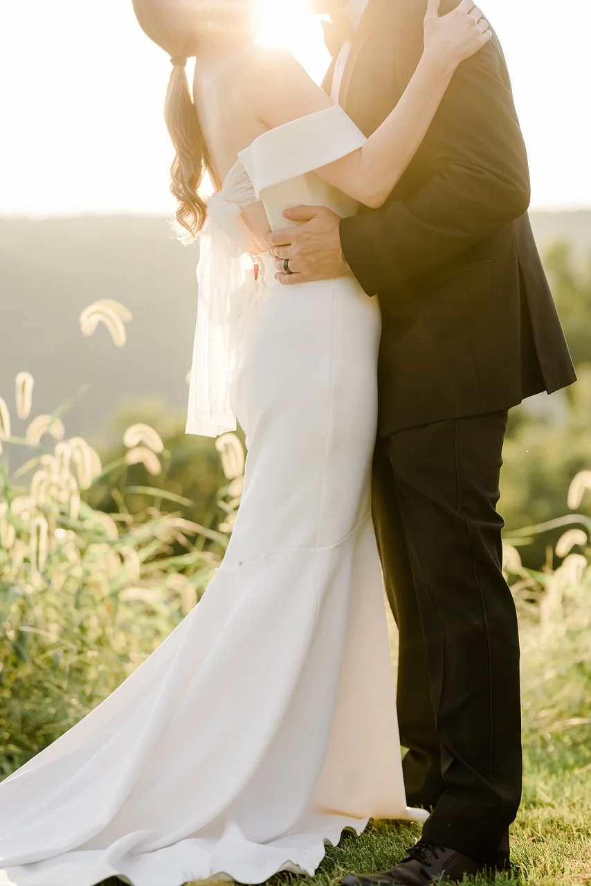 Photo of a bride and groom holding each other Bride and groom holding each other in a photo